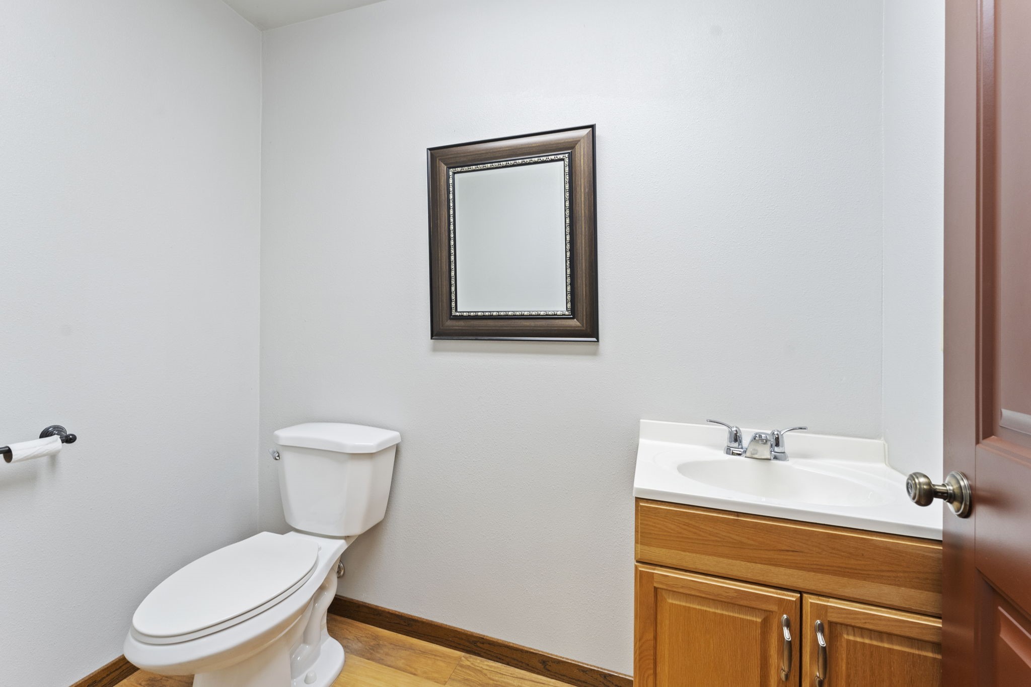 11534 Clint Parker Road Conroe, TX 77303 - Photo 41 of 50 a white toilet sitting next to a bathroom sink