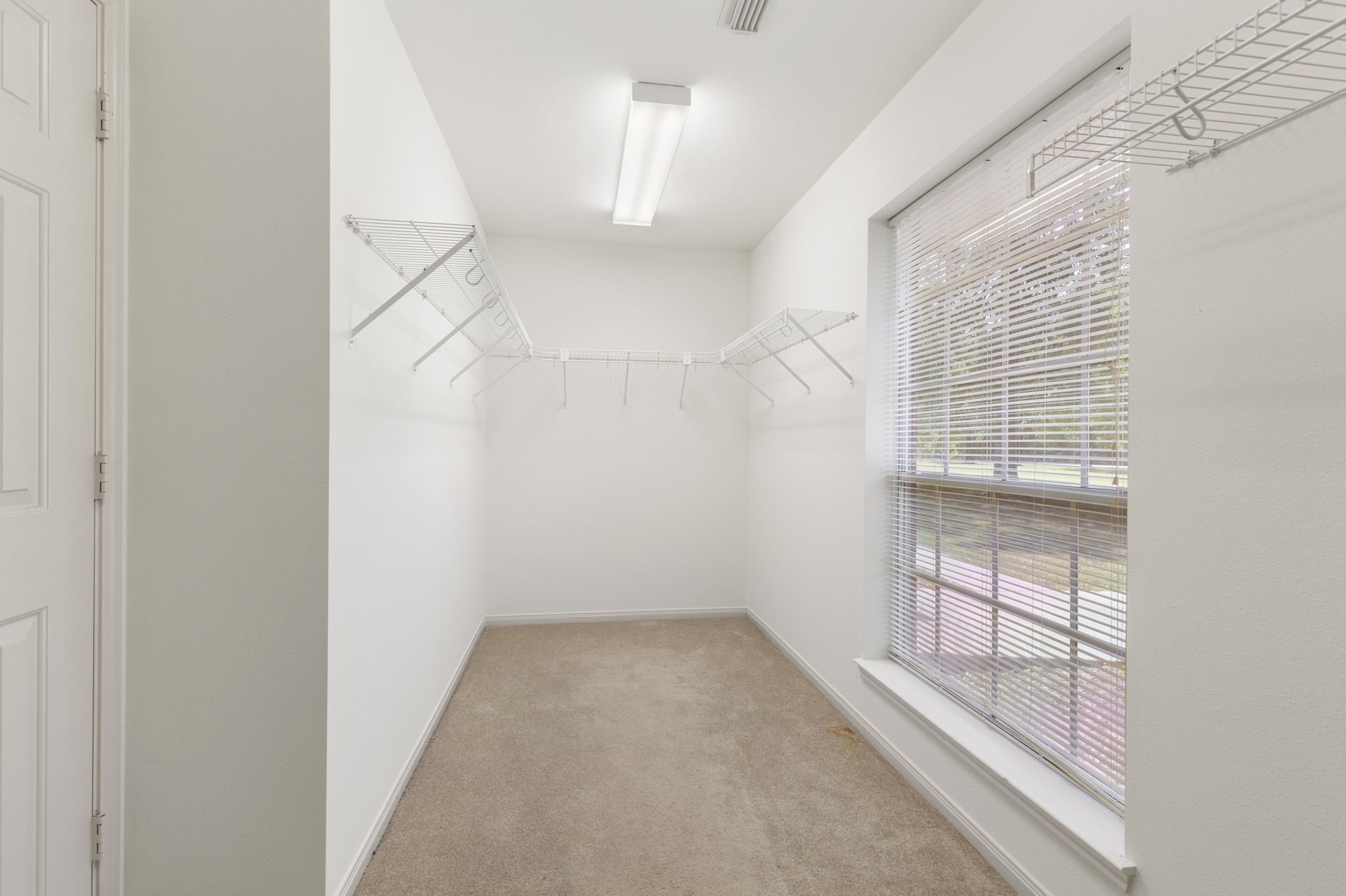 11534 Clint Parker Road Conroe, TX 77303 - Photo 8 of 50 an empty room with windows