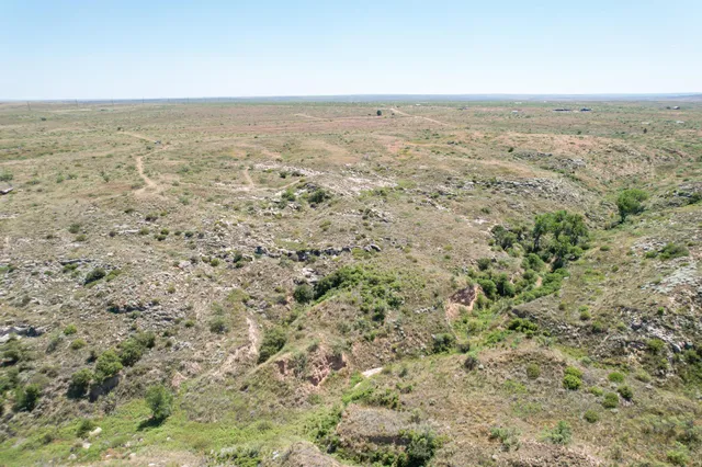 an aerial view of beach and an ocean