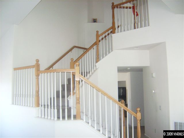 1665 Legacy Village Road Reno, NV 89521 - Photo 7 of 9 a view of staircase with railing and white walls