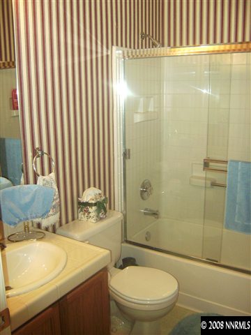1665 Legacy Village Road Reno, NV 89521 - Photo 9 of 9 a bathroom with a sink toilet and shower