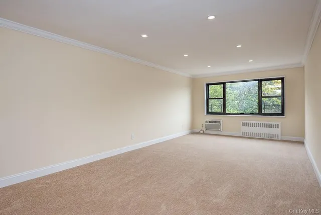 a view of a big room with windows and mountain view