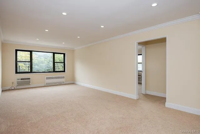 an empty room with a outdoor view and windows