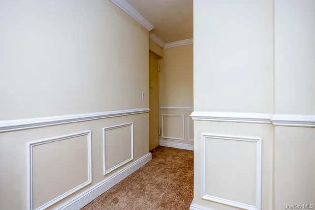 a view of walk in closet with empty room