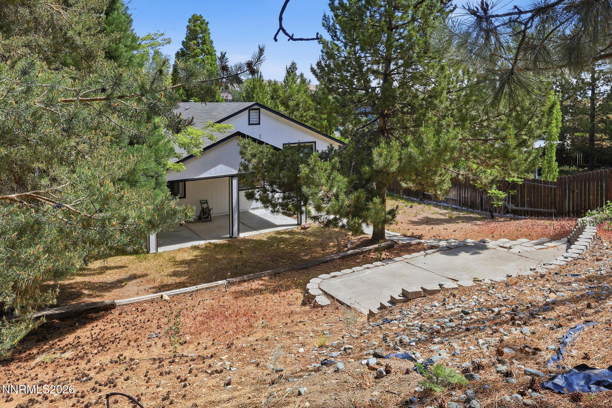 6840 Viscaya Court Reno, NV 89523 - Photo 4 of 25 a front view of a house with a yard
