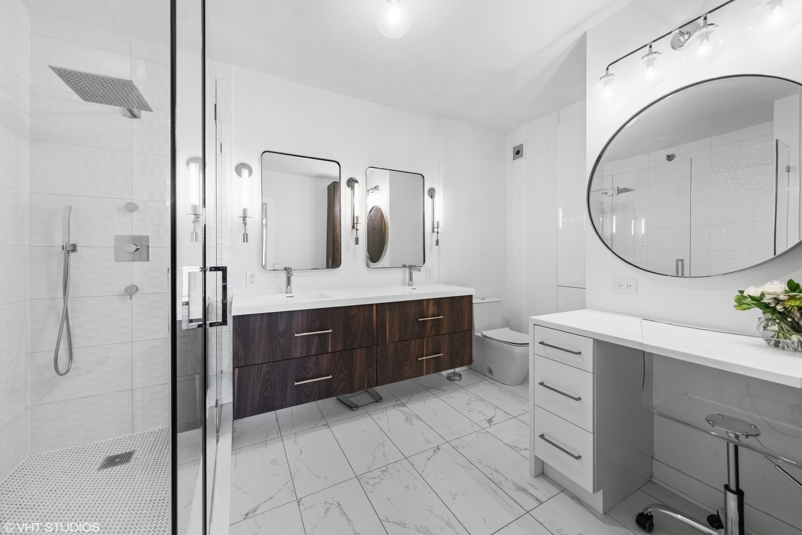 55 West Delaware Place, Unit 613 Chicago, IL 60610 - Photo 13 of 29 a spacious bathroom with a double vanity sink a mirror and a shower