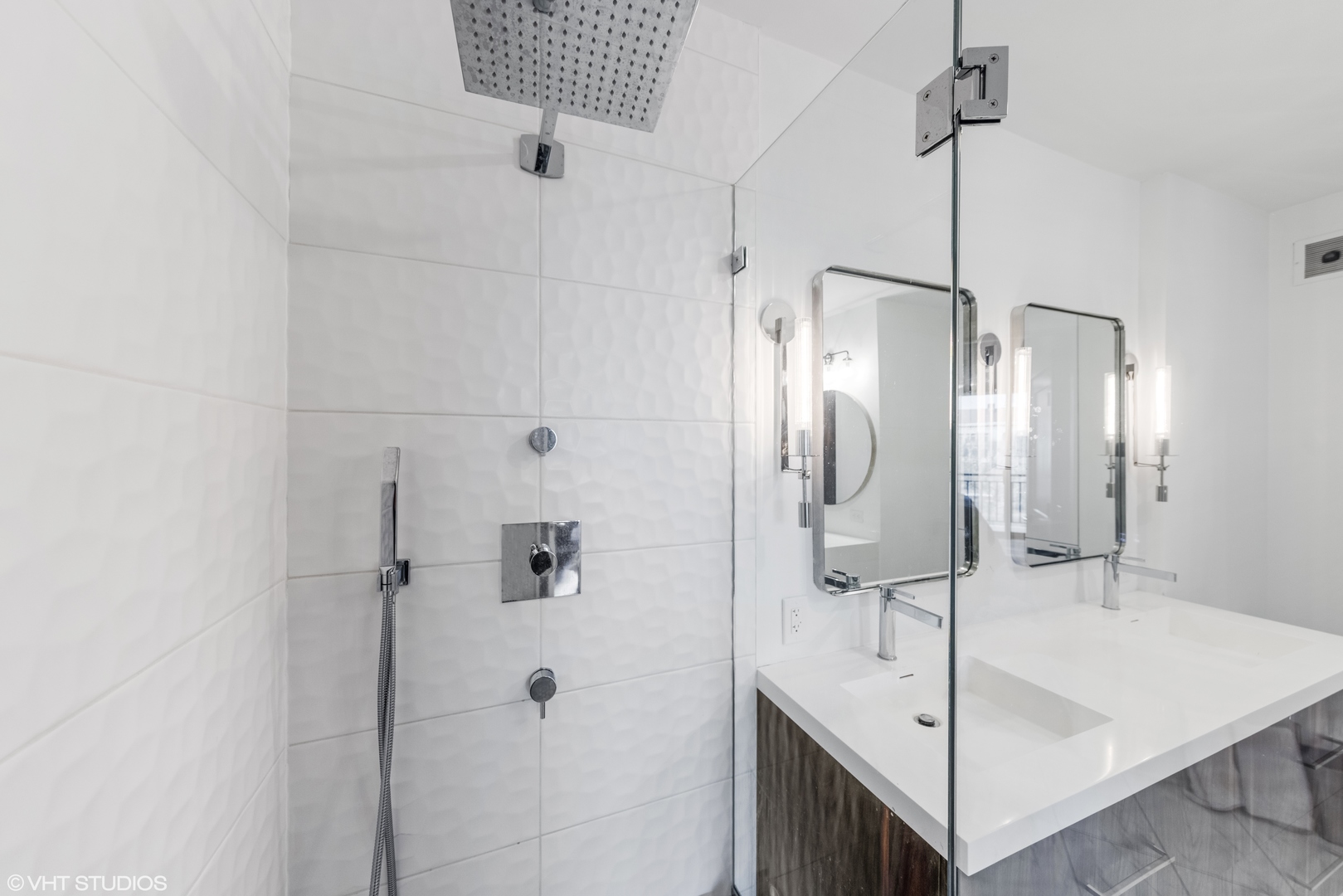 55 West Delaware Place, Unit 613 Chicago, IL 60610 - Photo 15 of 29 a bathroom with a shower and a sink