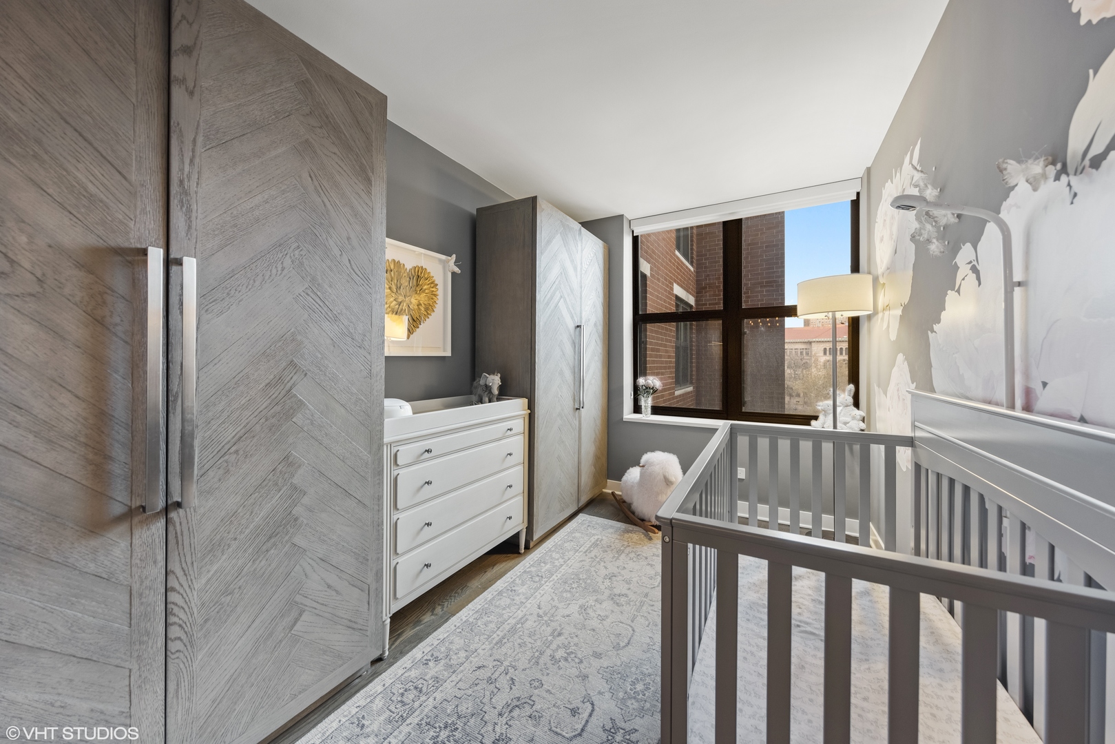 55 West Delaware Place, Unit 613 Chicago, IL 60610 - Photo 17 of 29 a view of a hallway with windows and cabinet