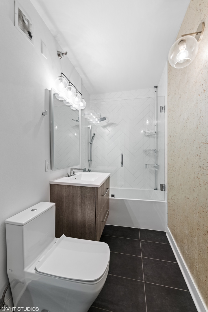 55 West Delaware Place, Unit 613 Chicago, IL 60610 - Photo 18 of 29 a bathroom with a sink toilet and shower