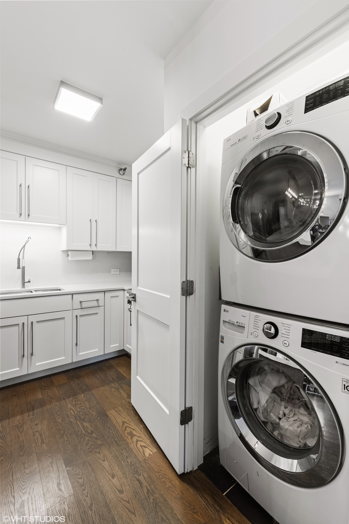 55 West Delaware Place, Unit 613 Chicago, IL 60610 - Photo 23 of 29 a utility room with sink washer and dryer