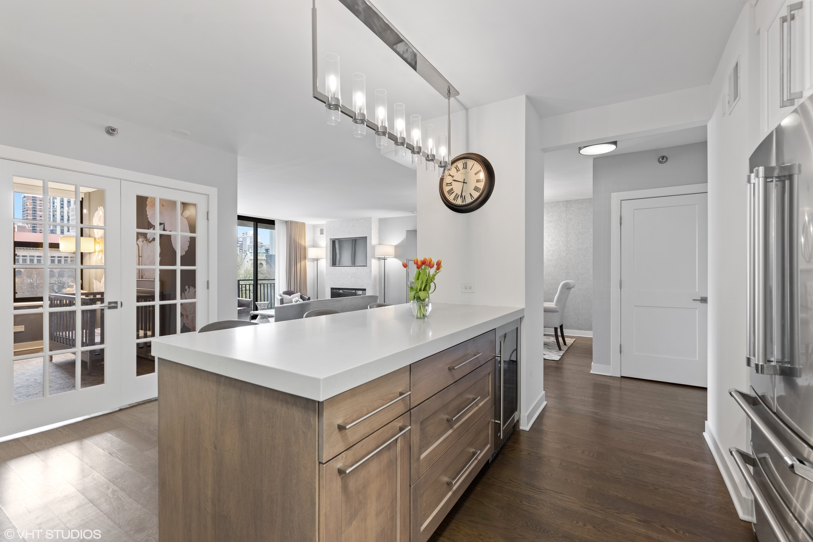 55 West Delaware Place, Unit 613 Chicago, IL 60610 - Photo 4 of 29 a view of living room kitchen with stainless steel appliances granite countertop furniture and a view of living room