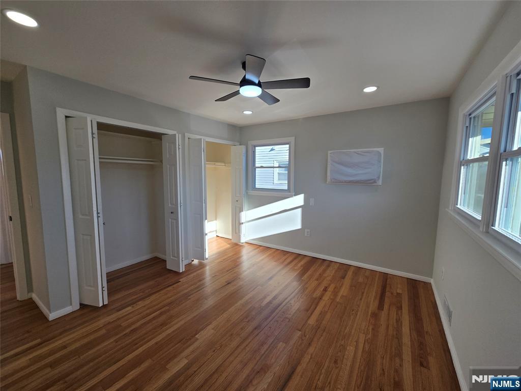 691 9th Street, Unit 2 Secaucus, NJ 07094 - Photo 10 of 16 wooden floor in an empty room with a window