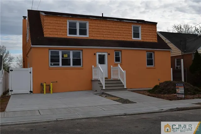 a front view of a house with garage