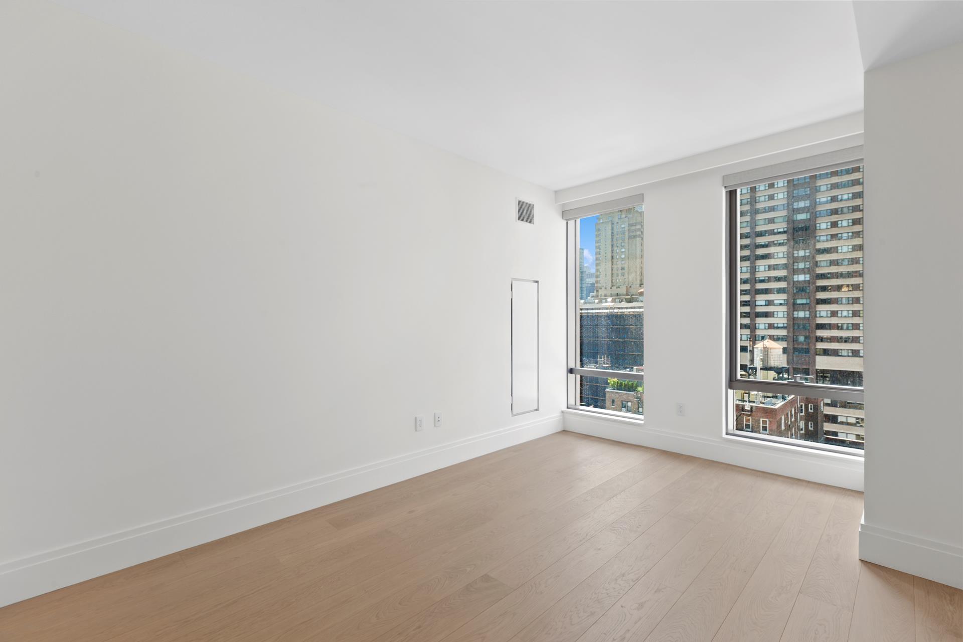 50 West 66th Street, Unit 15E Manhattan, NY 10023 - Photo 11 of 12 an empty room with windows
