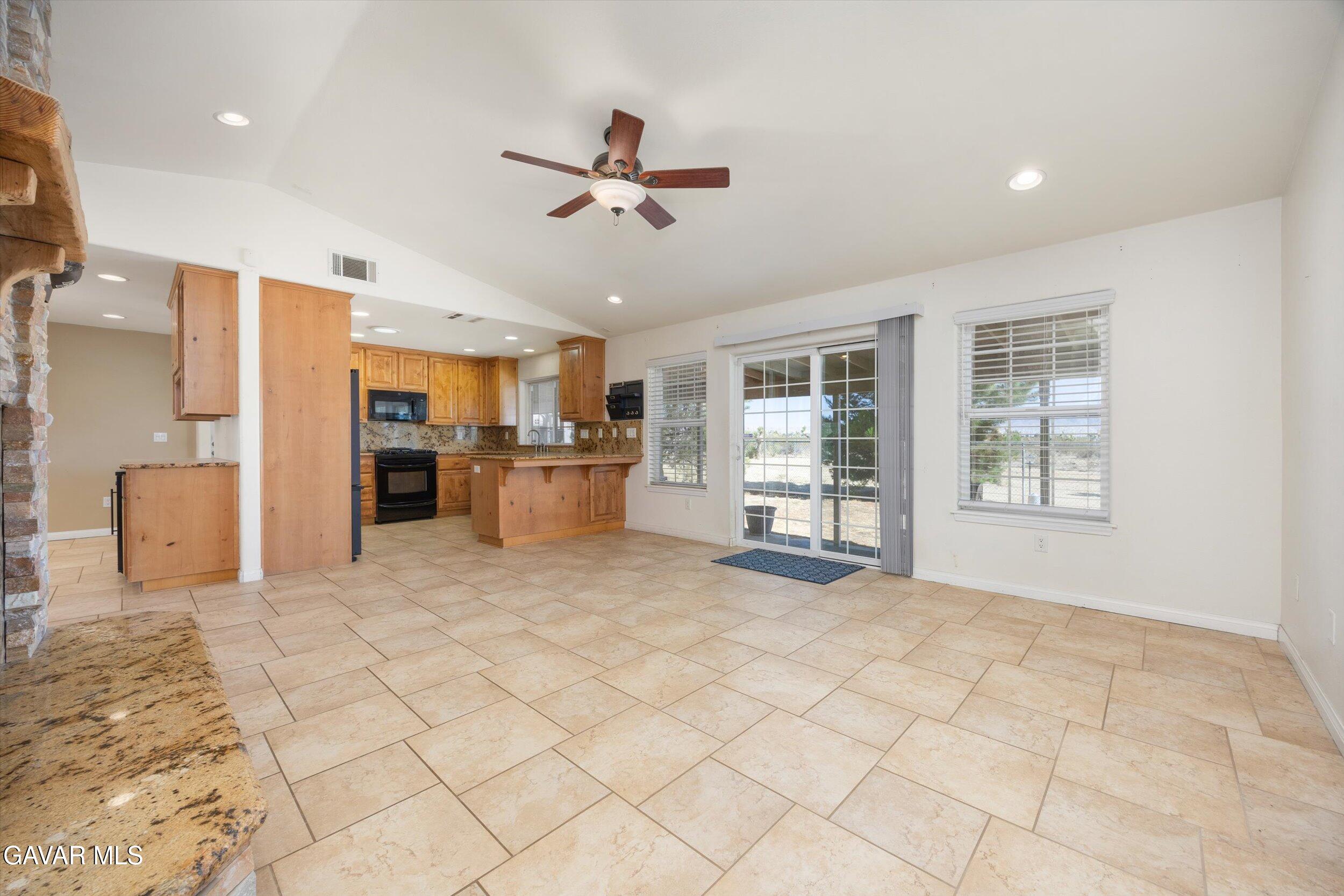 4961 Montiverde Road Mojave, CA 93501 - Photo 17 of 57 a view of a kitchen with furniture and a window