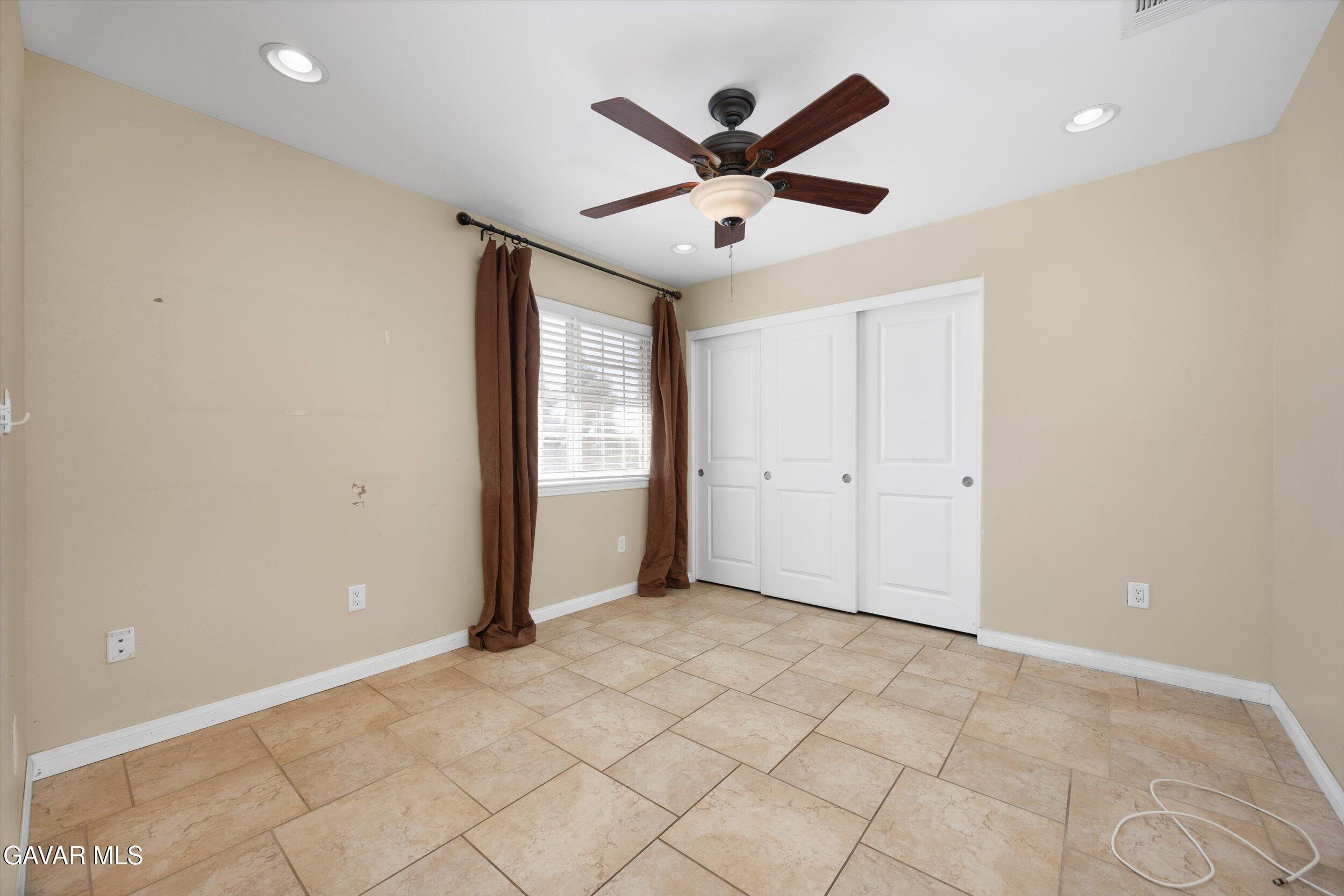 4961 Montiverde Road Mojave, CA 93501 - Photo 42 of 57 an empty room with closet and windows