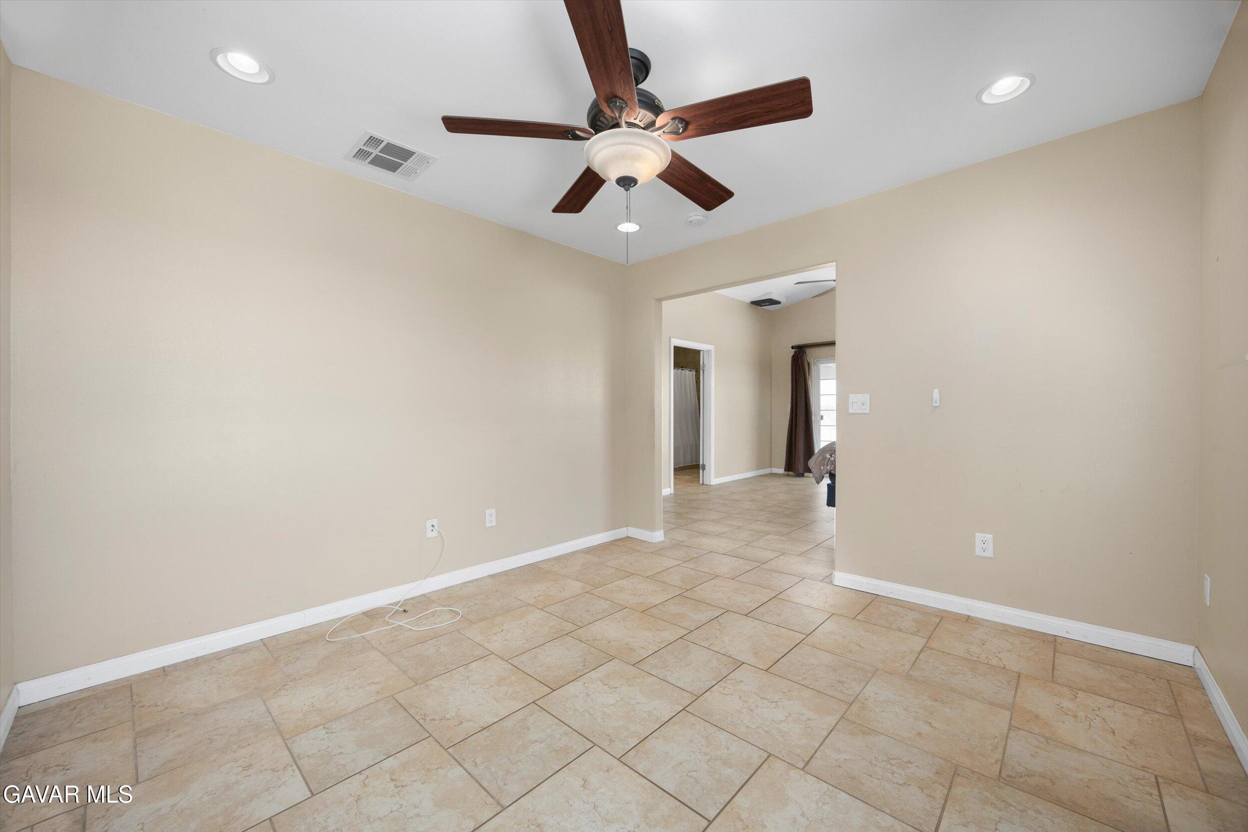 4961 Montiverde Road Mojave, CA 93501 - Photo 43 of 57 an empty room with fan and a ceiling fan