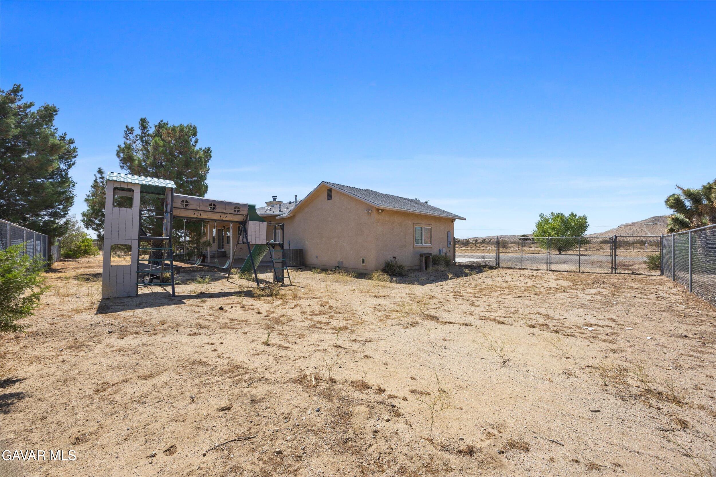 4961 Montiverde Road Mojave, CA 93501 - Photo 51 of 57 a view of a backyard with a sink and chairs