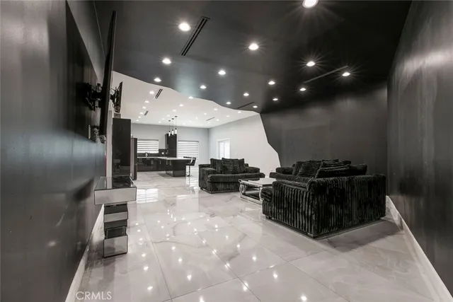 a kitchen with stainless steel appliances kitchen island granite countertop a sink and cabinets