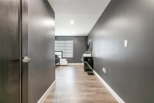 a bedroom with a bed and a mirror