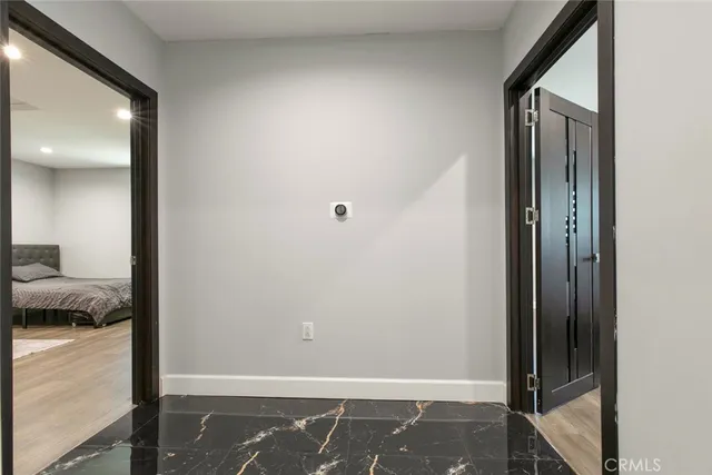 a spacious bedroom with a bed and a table in it