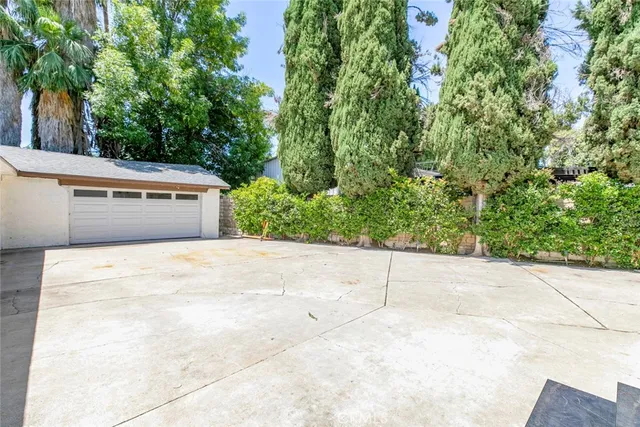 a backyard of a house with yard and garage