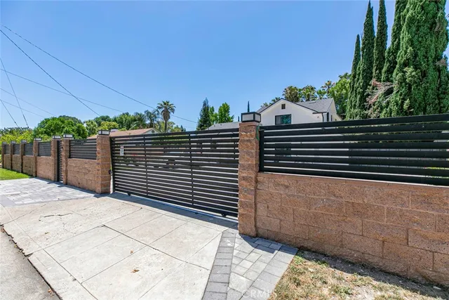 a view of a pathway both side of house