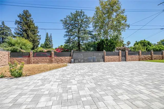 a view of green field with house in the background