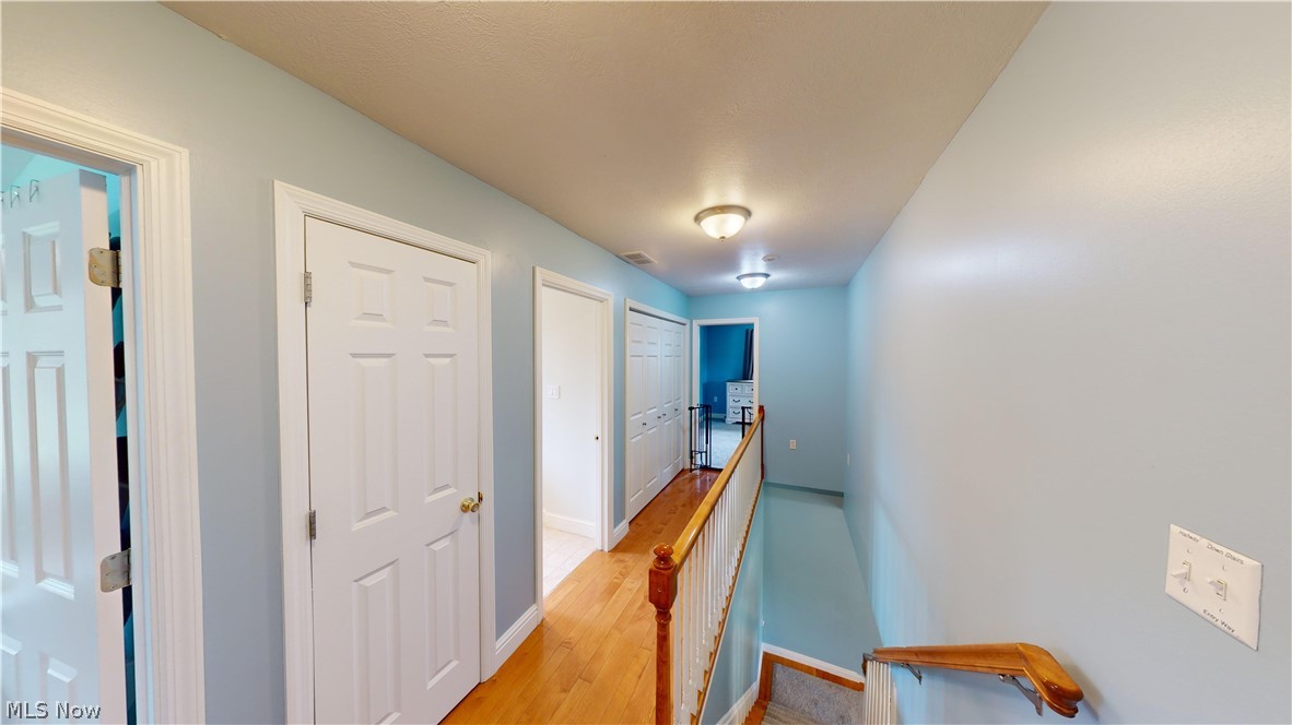 290 McIntosh Road Chester, WV 26034 - Photo 19 of 43 Corridor with light wood-type flooring