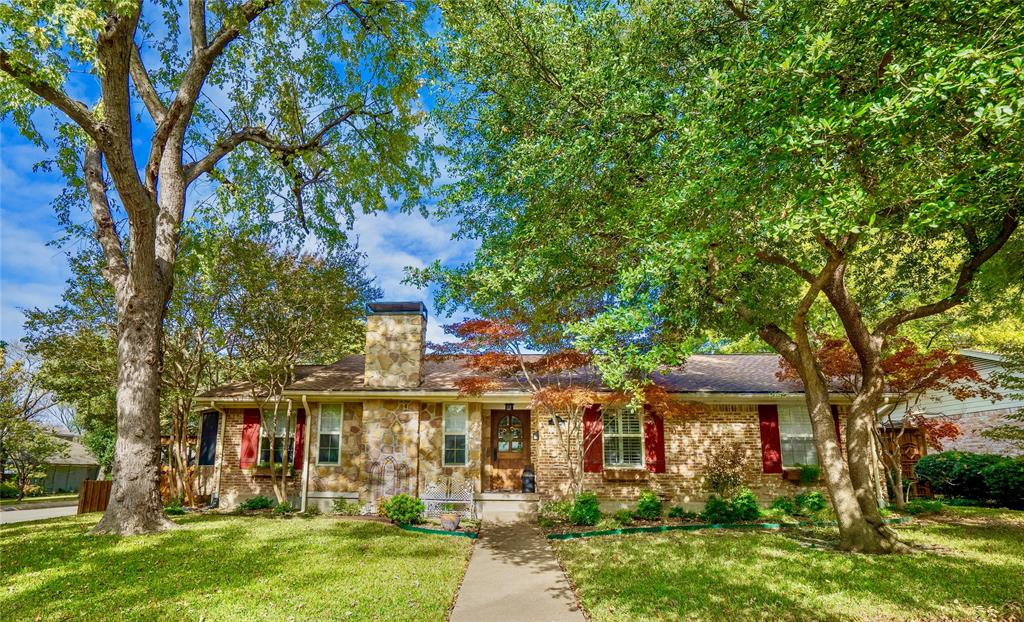 10905 Cactus Lane Dallas, TX 75238 - Photo 1 of 1 front view of house with a yard