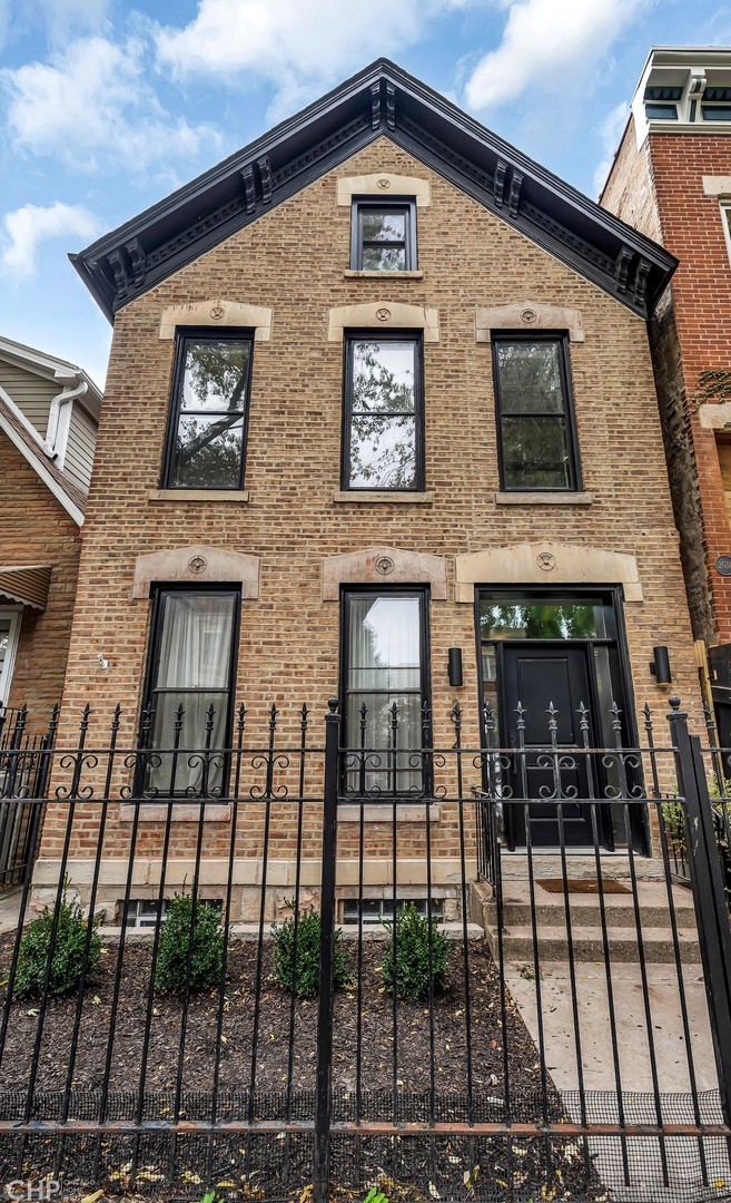 2014 North Oakley Avenue, Unit 1 Chicago, IL 60647 - Photo 1 of 19 a front view of a house with glass windows