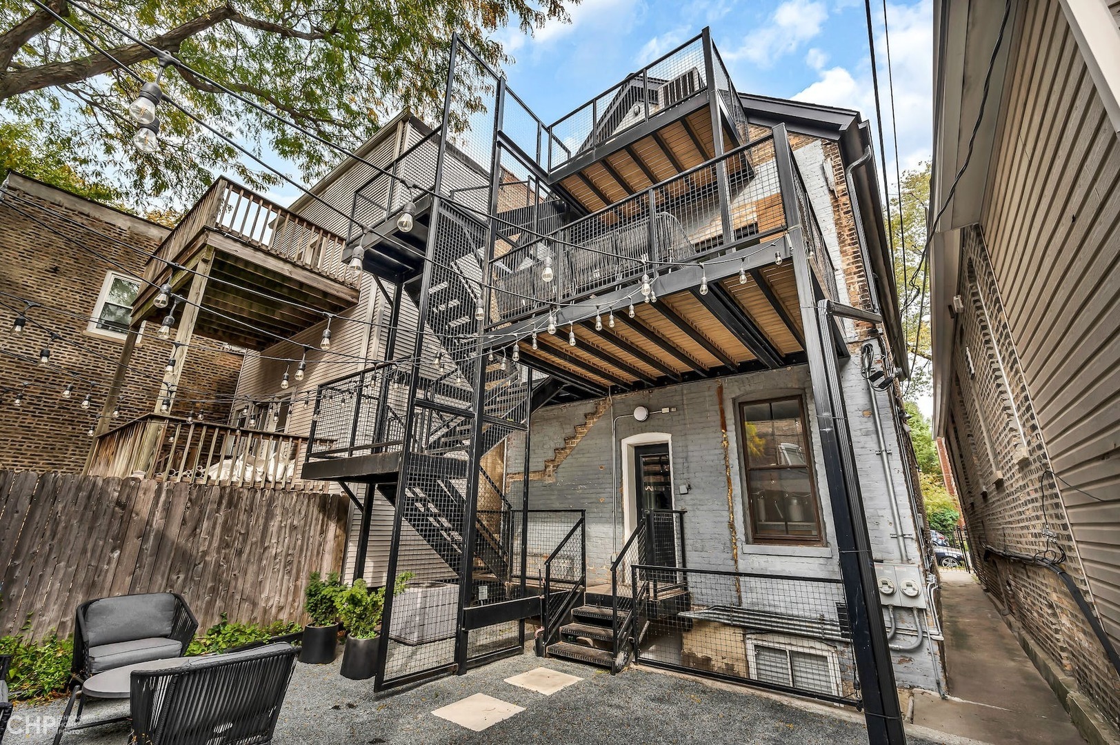 2014 North Oakley Avenue, Unit 1 Chicago, IL 60647 - Photo 15 of 19 front view of a house with a bench