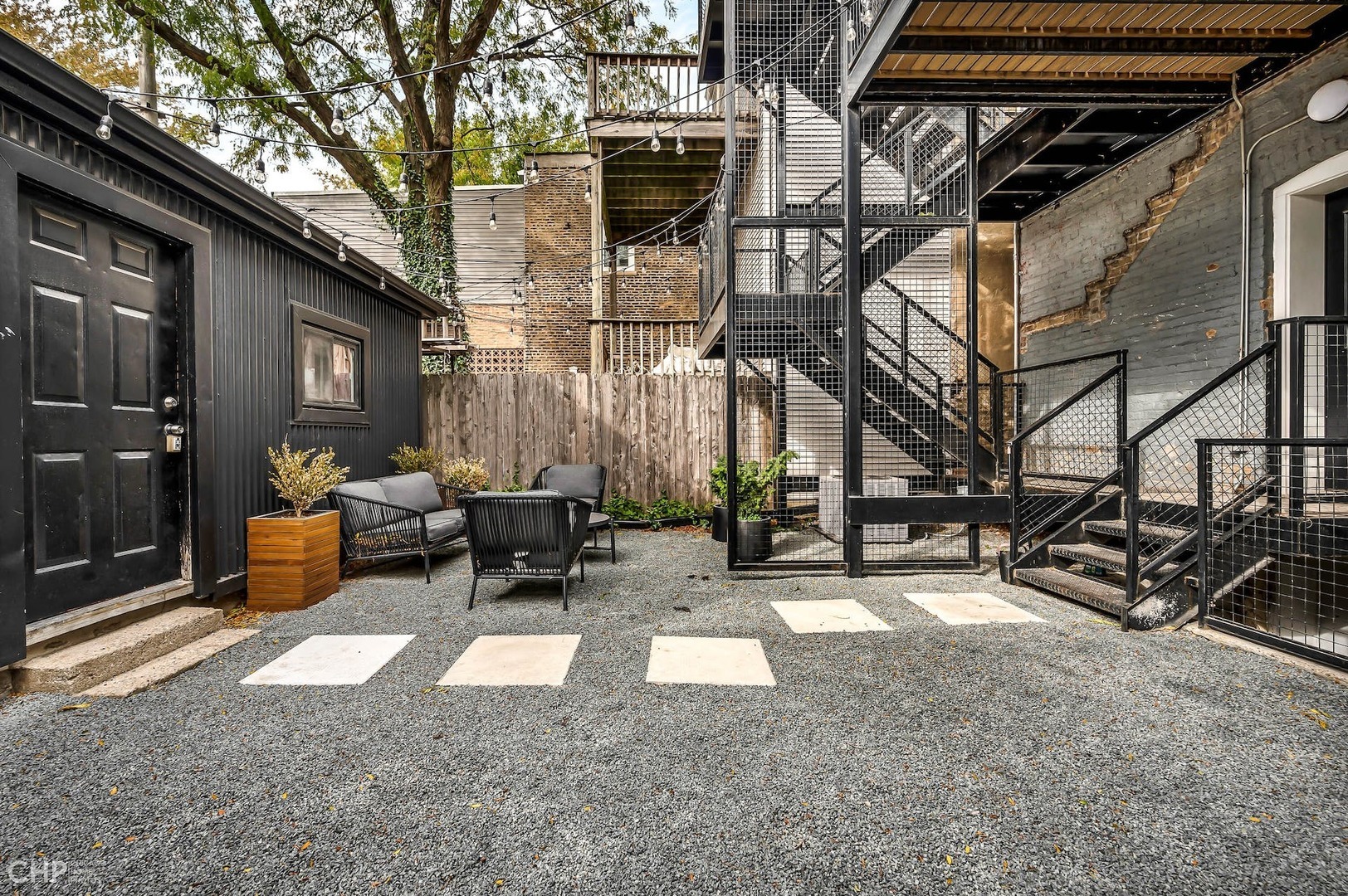 2014 North Oakley Avenue, Unit 1 Chicago, IL 60647 - Photo 17 of 19 a view of a building with a bench in front of building