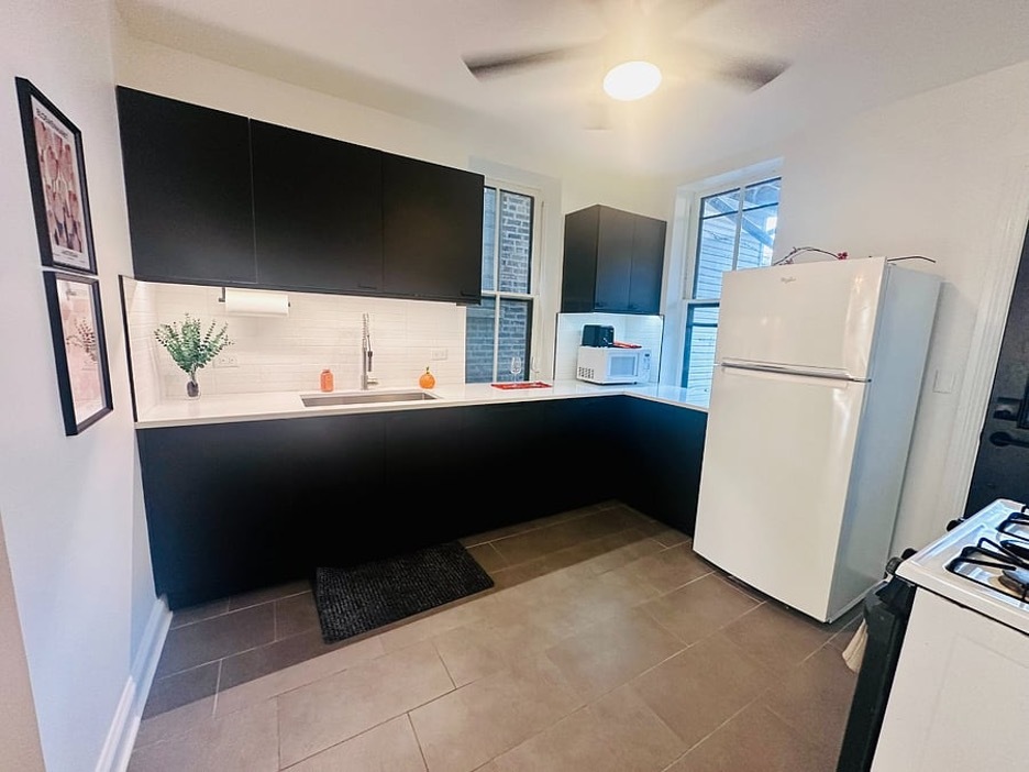 2014 North Oakley Avenue, Unit 1 Chicago, IL 60647 - Photo 8 of 19 a kitchen with a refrigerator and a sink