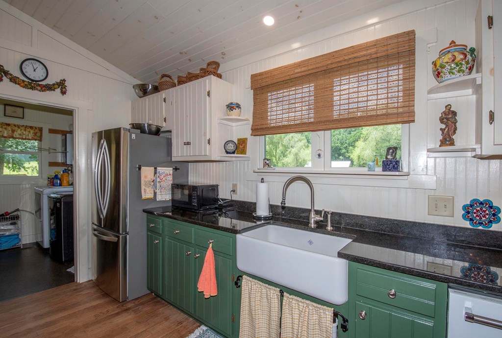 41 Pine Trail Warne, NC 28909 - Photo 15 of 43 a kitchen with granite countertop a sink stove and refrigerator