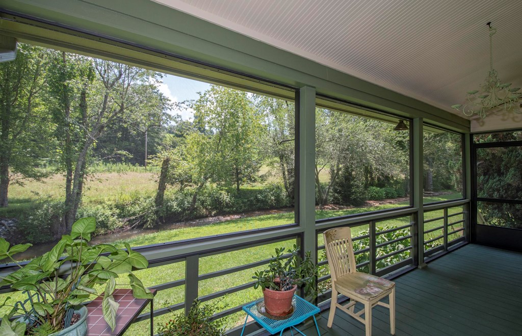 41 Pine Trail Warne, NC 28909 - Photo 19 of 43 a view of a porch with furniture and garden
