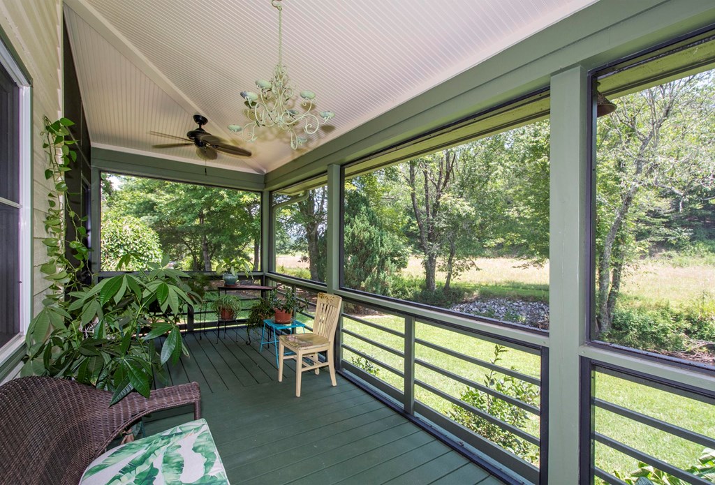 41 Pine Trail Warne, NC 28909 - Photo 20 of 43 a view of a porch with furniture and garden