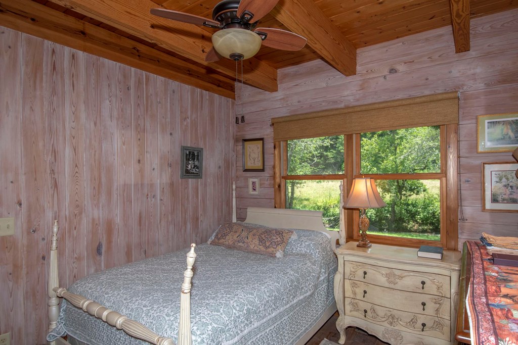 41 Pine Trail Warne, NC 28909 - Photo 24 of 43 a bedroom with a bed and a window