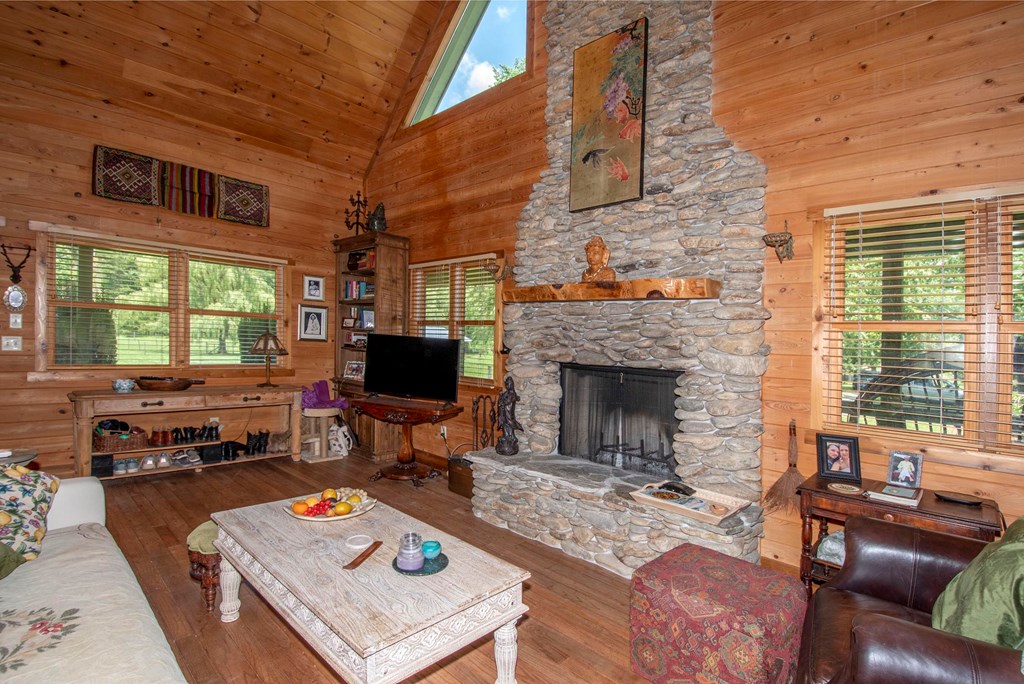 41 Pine Trail Warne, NC 28909 - Photo 7 of 43 a living room with furniture a fireplace and next to a window