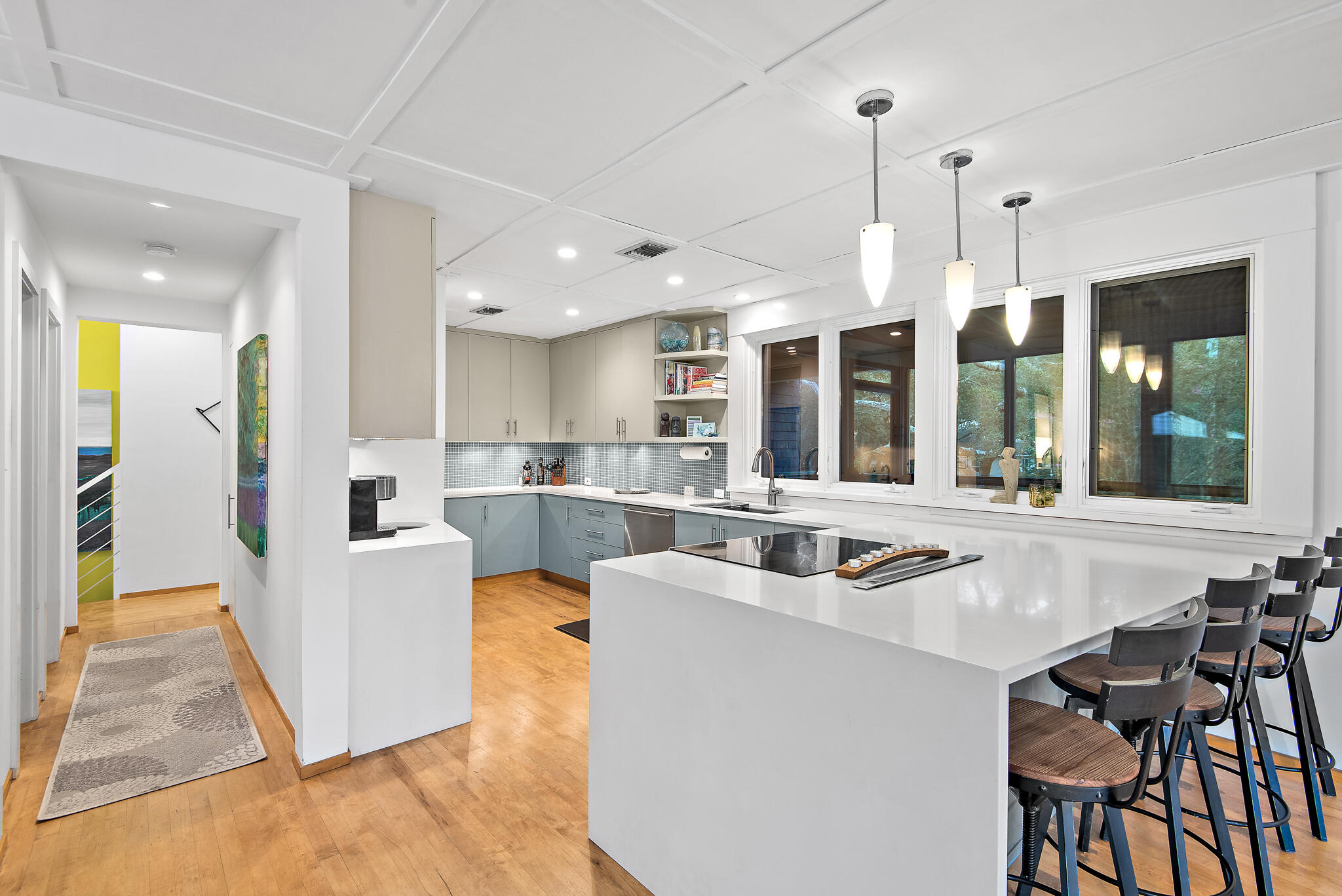 235 North Bishop Road Santa Rosa Beach, FL 32459 - Photo 15 of 68 a kitchen with a table chairs refrigerator and cabinets