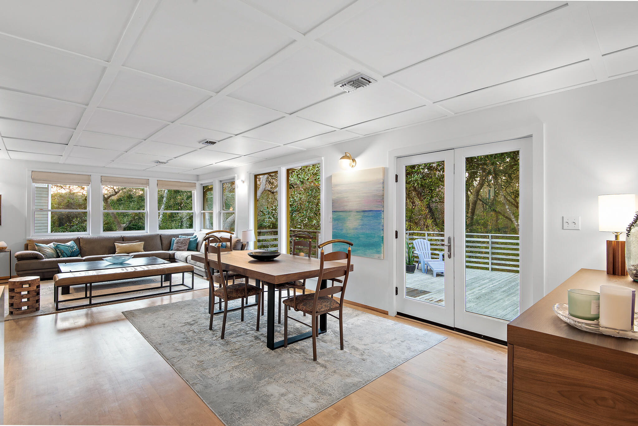 235 North Bishop Road Santa Rosa Beach, FL 32459 - Photo 21 of 68 a view of a dining room with furniture large windows and wooden floor