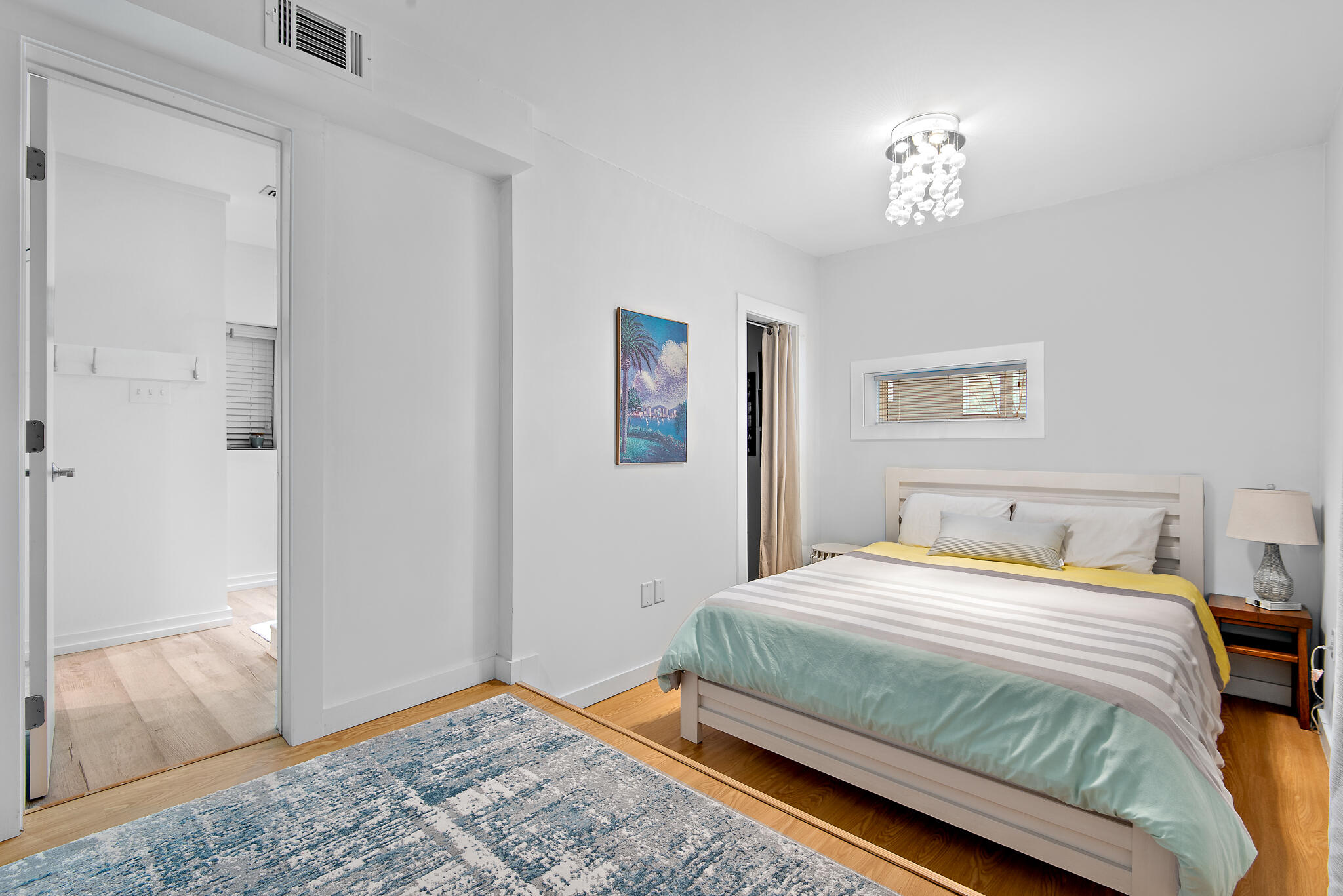 235 North Bishop Road Santa Rosa Beach, FL 32459 - Photo 36 of 68 a bedroom with a bed and a painting on the wall