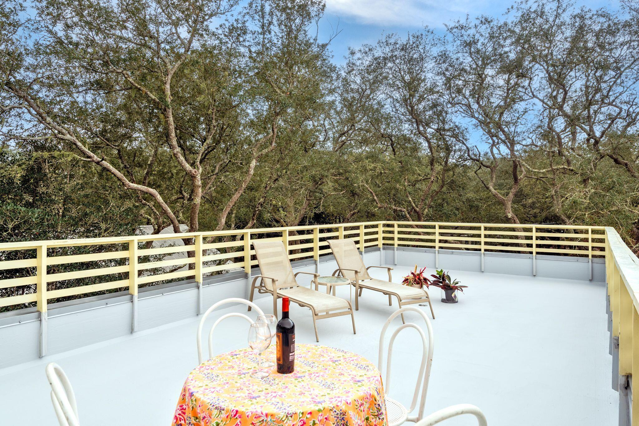 235 North Bishop Road Santa Rosa Beach, FL 32459 - Photo 60 of 68 a picture of a table and chairs