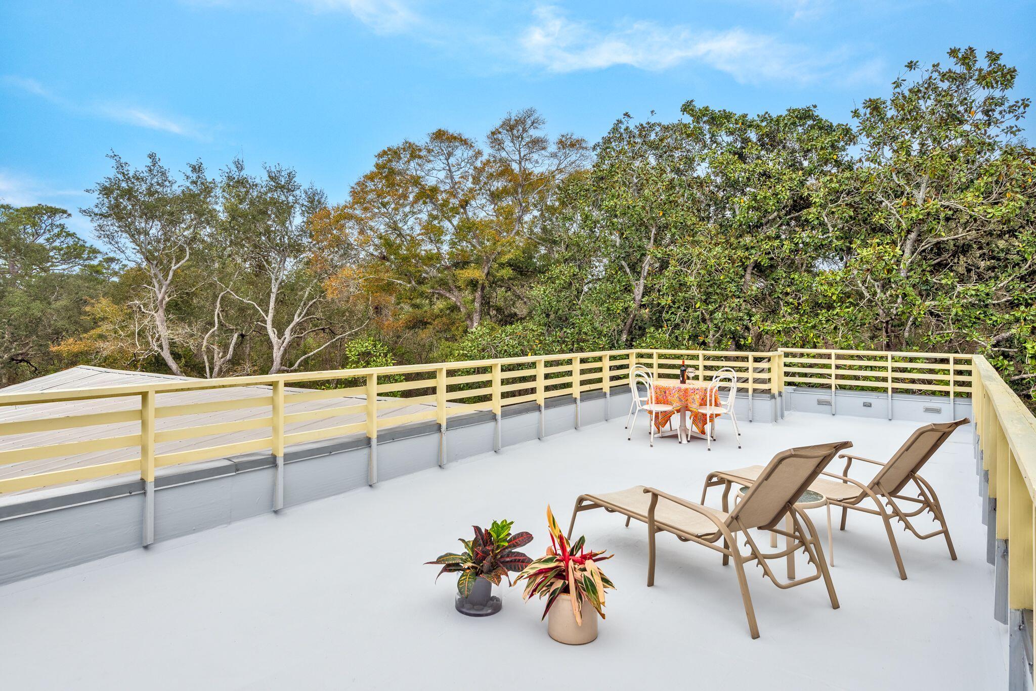235 North Bishop Road Santa Rosa Beach, FL 32459 - Photo 61 of 68 a view of a chairs and table on the terrace