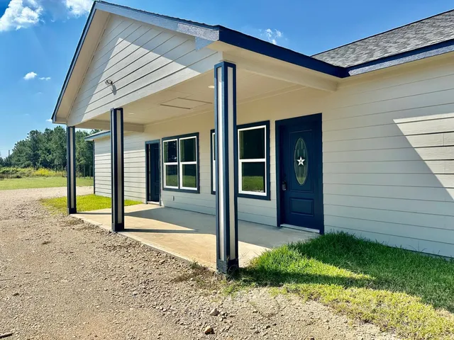 a view of a porch with seating space