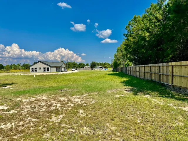 a view of a golf course with a lake view