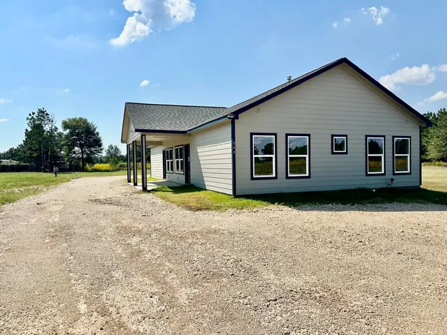 a house with trees in the background