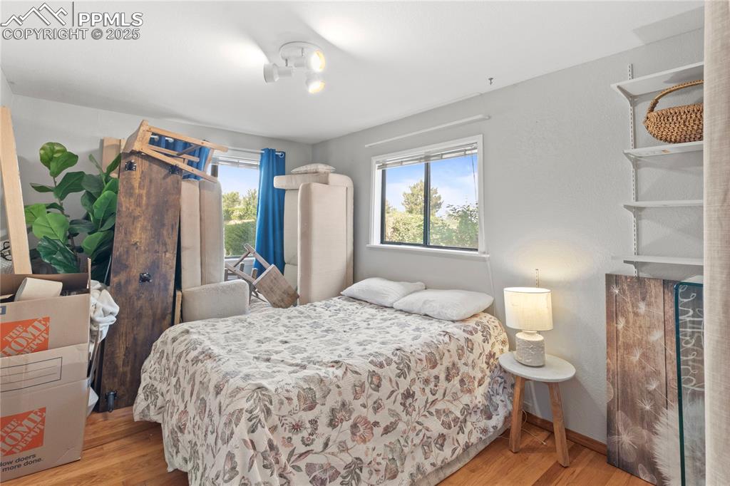 1215 Sunset Road Colorado Springs, CO 80909 - Photo 21 of 40 Good sized bedroom on main with Peak view