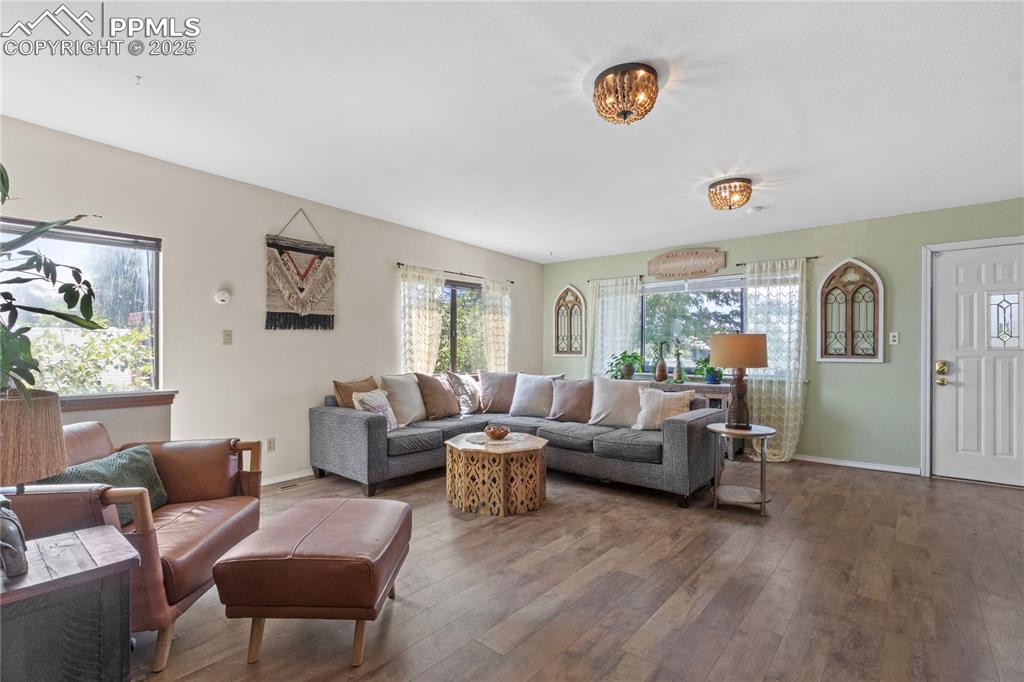 1215 Sunset Road Colorado Springs, CO 80909 - Photo 8 of 40 Light and bright living room with great view of Pike's Peak