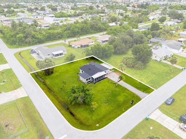 a view of a pool in a backyard